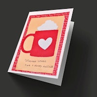 a greeting card with a heart and a cup of coffee